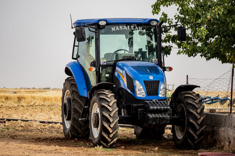 Blue Tractor On Field In Turkey