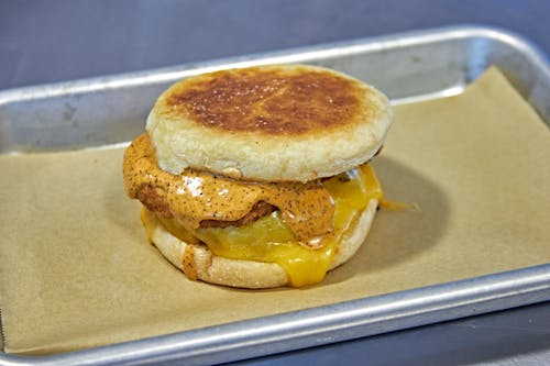 A delicious sausage and hashbrown sandwich on a toasted English muffin. 