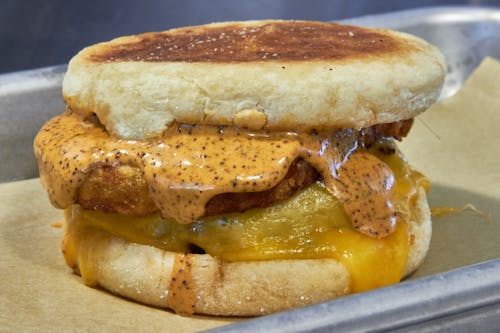 A delicious sausage and hashbrown sandwich on a toasted English muffin. 