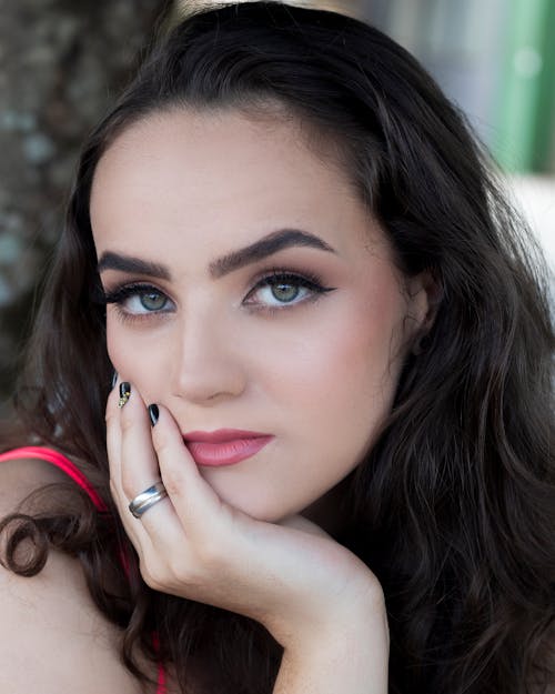 Brunette Woman Rests Chin on Hand