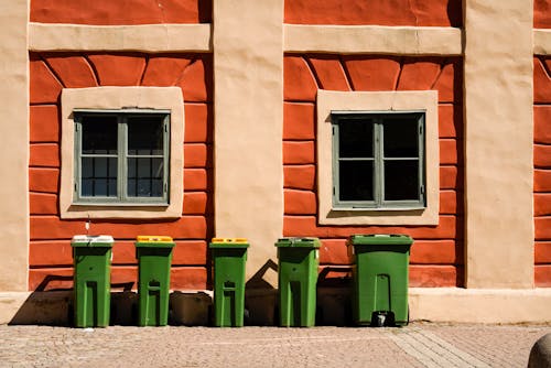 Garbage Bins in Front of a Building 
