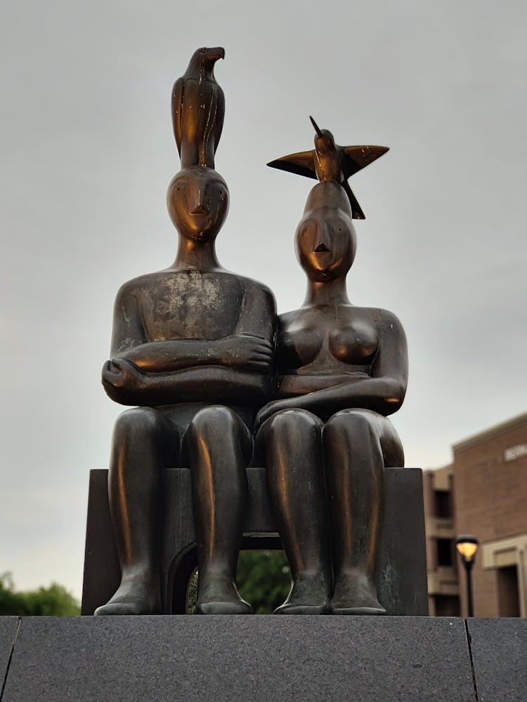 Sculpture Of Sitting Man And Woman With Birds On Their Heads, Northeastern Illinois University, USA