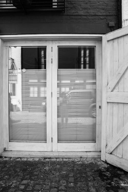 Black and White Picture of an Entrance with Glass Door
