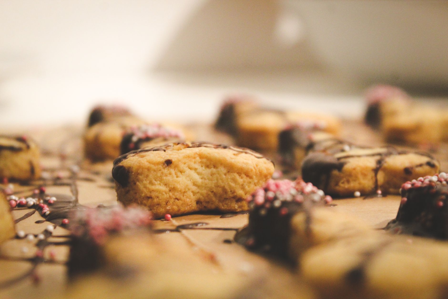 Close-up of almond sugar cookies with sliced almonds and powdered sugar
