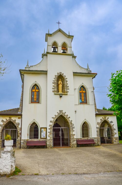 Free Beautiful facade of a historic church in Cadavéu, showcasing Gothic architecture under a bright sky. Stock Photo