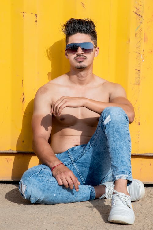 Topless Man in Sunglasses Sitting
