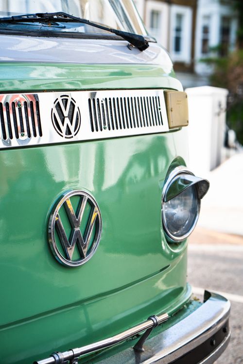 Free Close-up of a vintage Volkswagen camper van displaying its iconic logo outdoors. Stock Photo