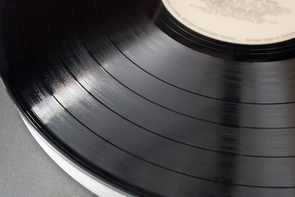 Detailed close-up of a classic vinyl record showing grooves and texture.