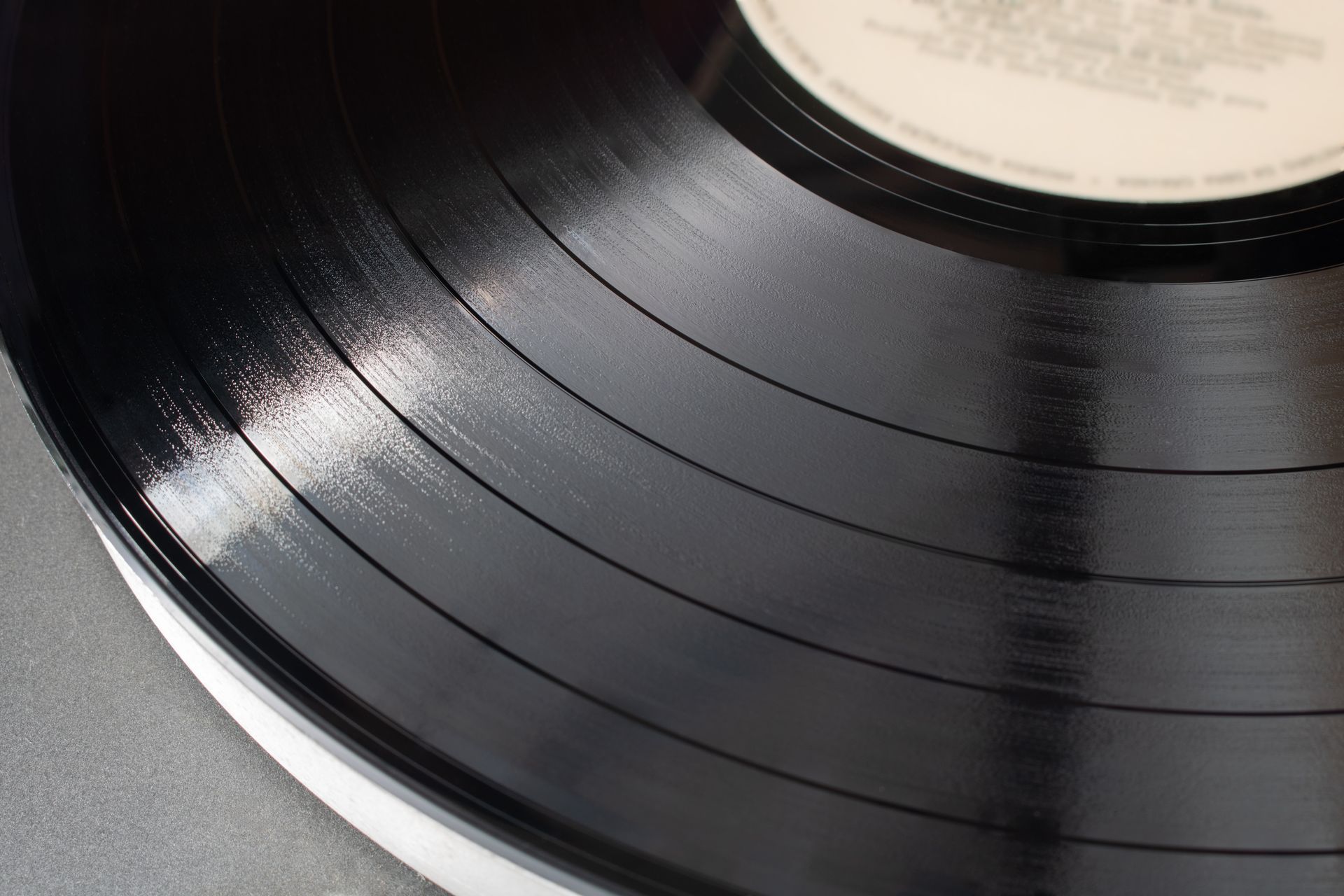 Detailed close-up of a classic vinyl record showing grooves and texture.