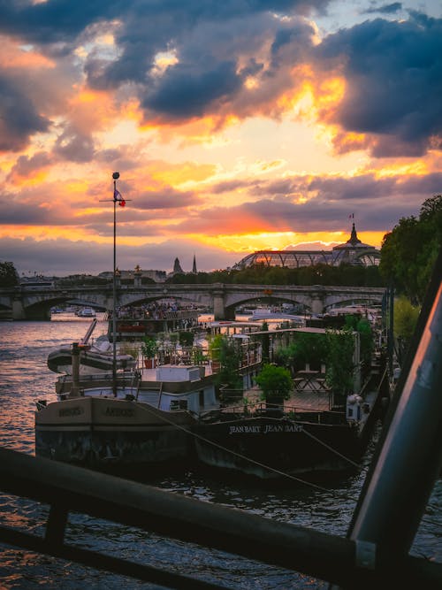 Boats in the Seine River at Sunset
