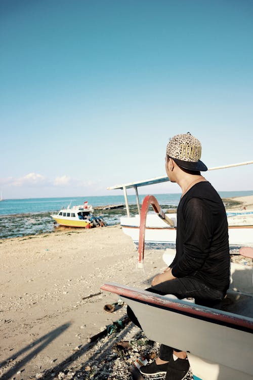 Man Sitting On A Boat