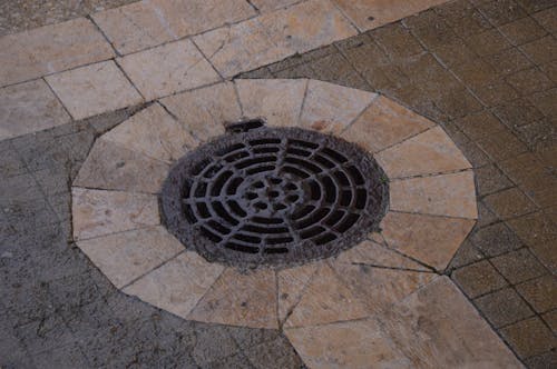 Iron Pothole on Sidewalk