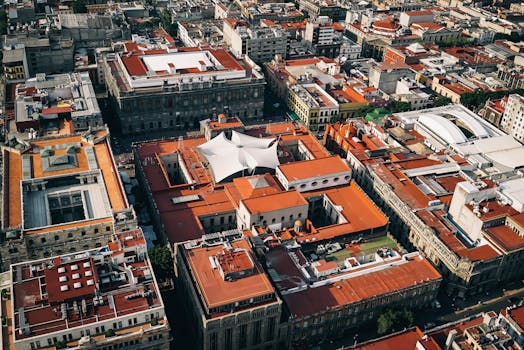 A stunning aerial view of Mexico City's iconic red rooftops and urban architecture.