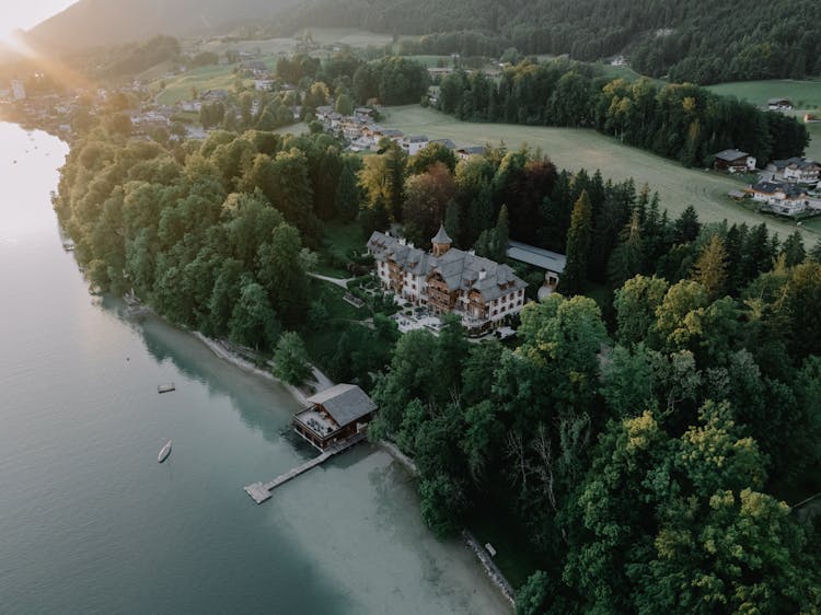 Drone Shot Of A Residence In The Woods On The Shore Of Lake Wolfgang, Salzburg, Austria 