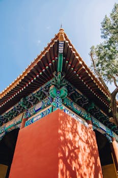 Close-up of a colorful, ornate temple roof with traditional architectural design.