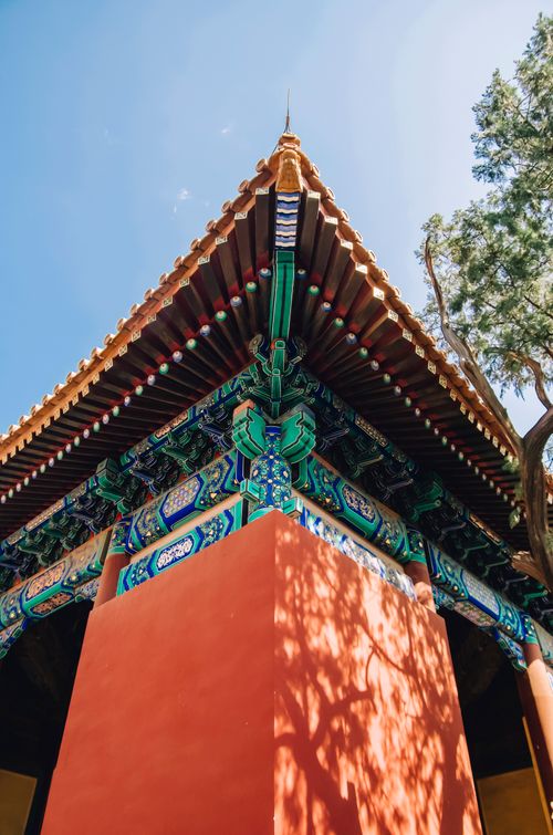 Free Close-up of a colorful, ornate temple roof with traditional architectural design. Stock Photo