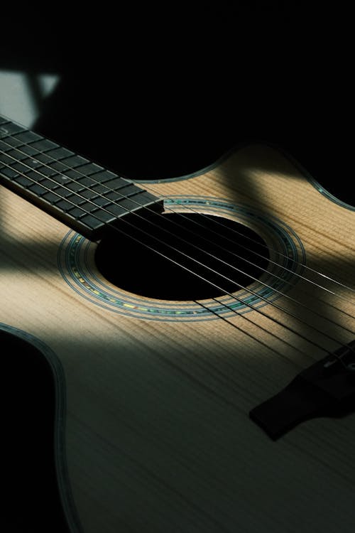 Close-up of Traditional Guitar in Dark