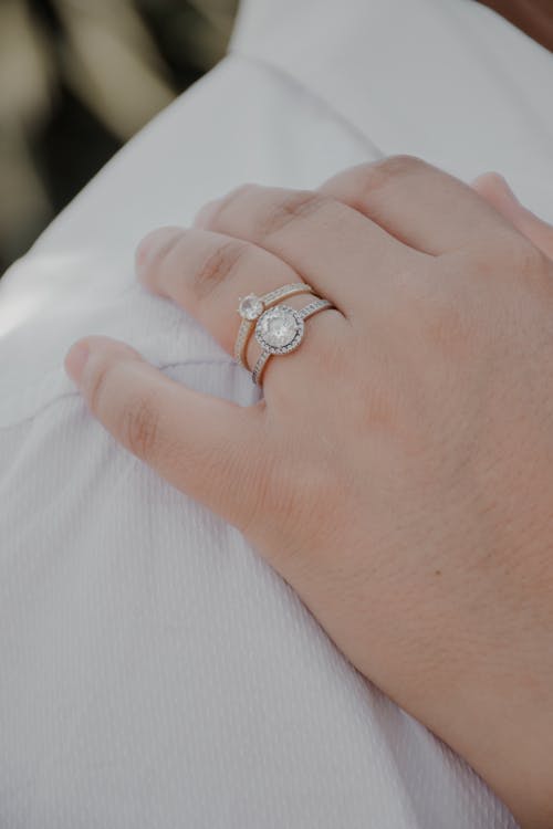 Close-up of Woman Hand with Wedding and Engagement Rings