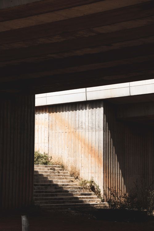 Free Concrete stairs with dramatic shadows under an overpass in Abuja, Nigeria. Stock Photo