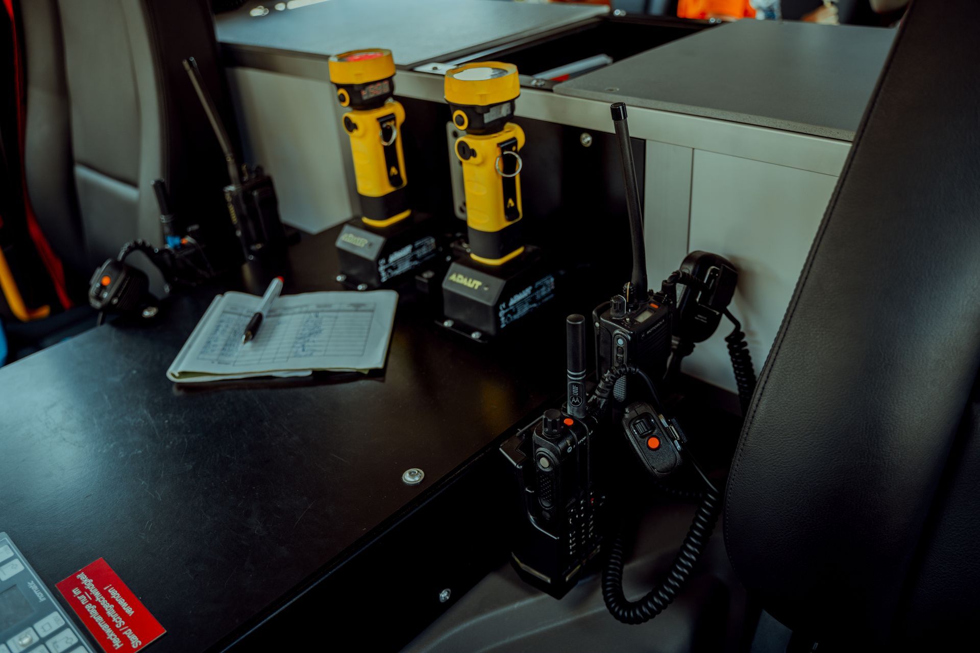 Focus on communication and lighting gear inside a control vehicle in Morsbach, Germany.