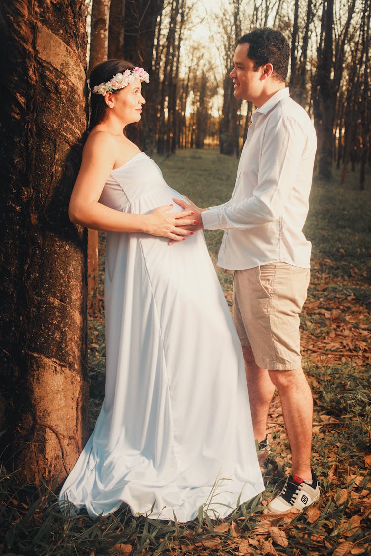 Man Touching Belly Of Expecting Woman