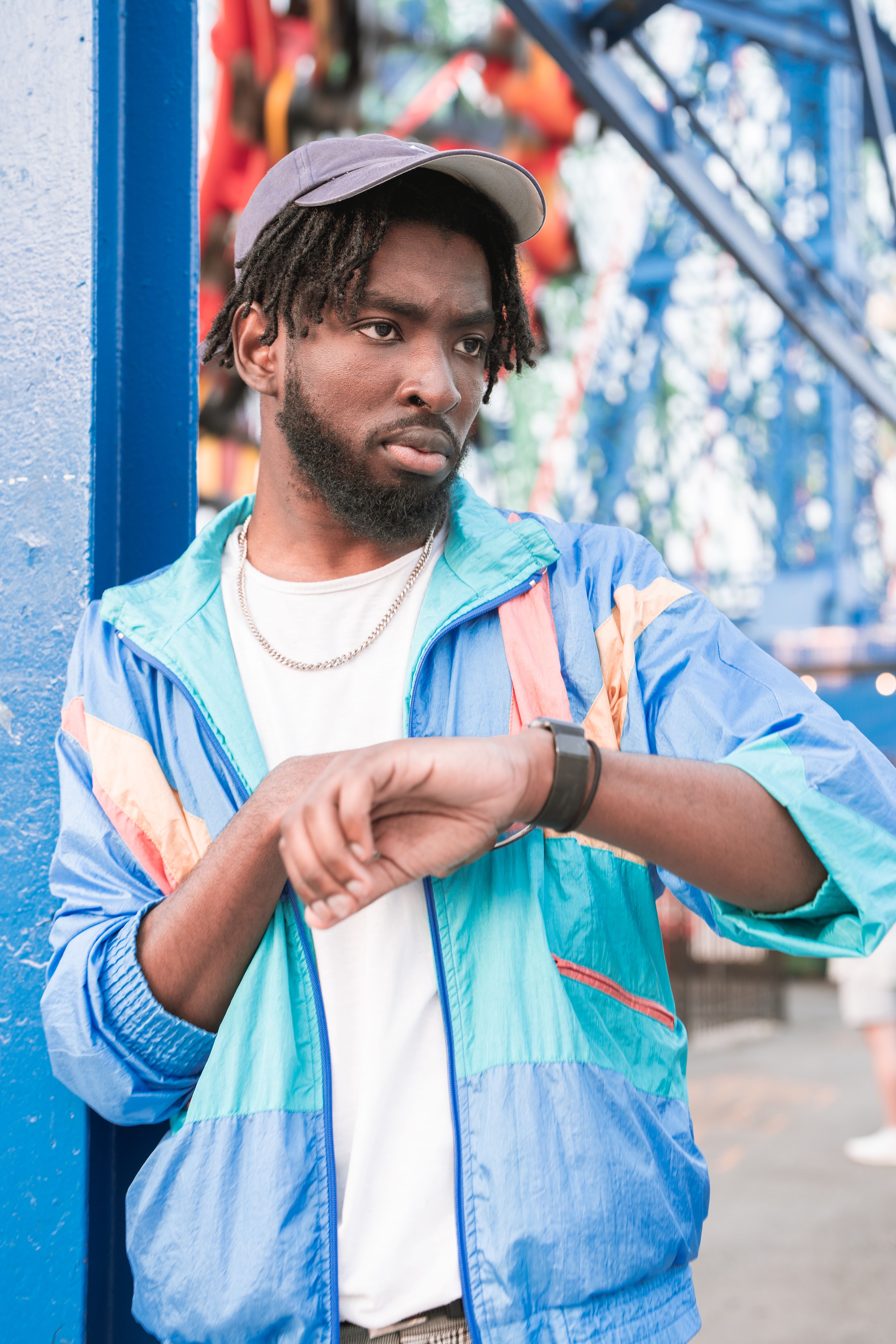 Young Bearded Man in a Casual Outfit Standing Outside · Free Stock Photo