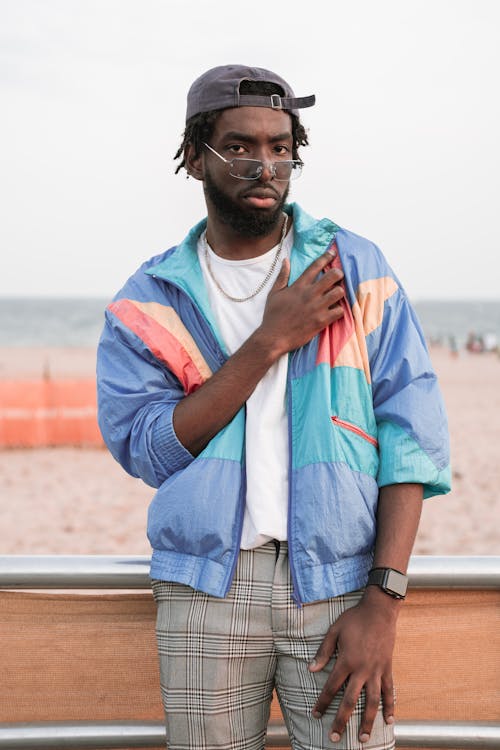 Young Bearded Man in a Casual Outfit Standing Outside 