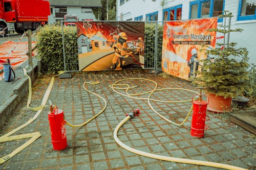 Hose and Extinguishers near Event Posters