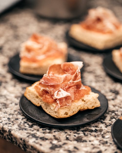 Bruschetta with Ham on a Table