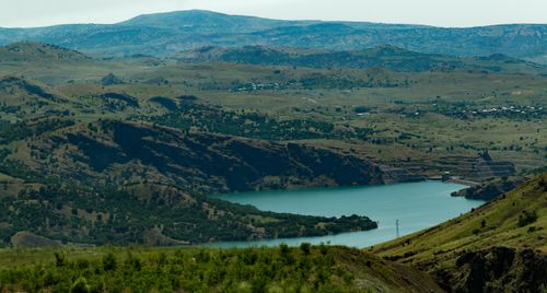 Free A tranquil view of mountains and a lake under a clear blue sky. Stock Photo
