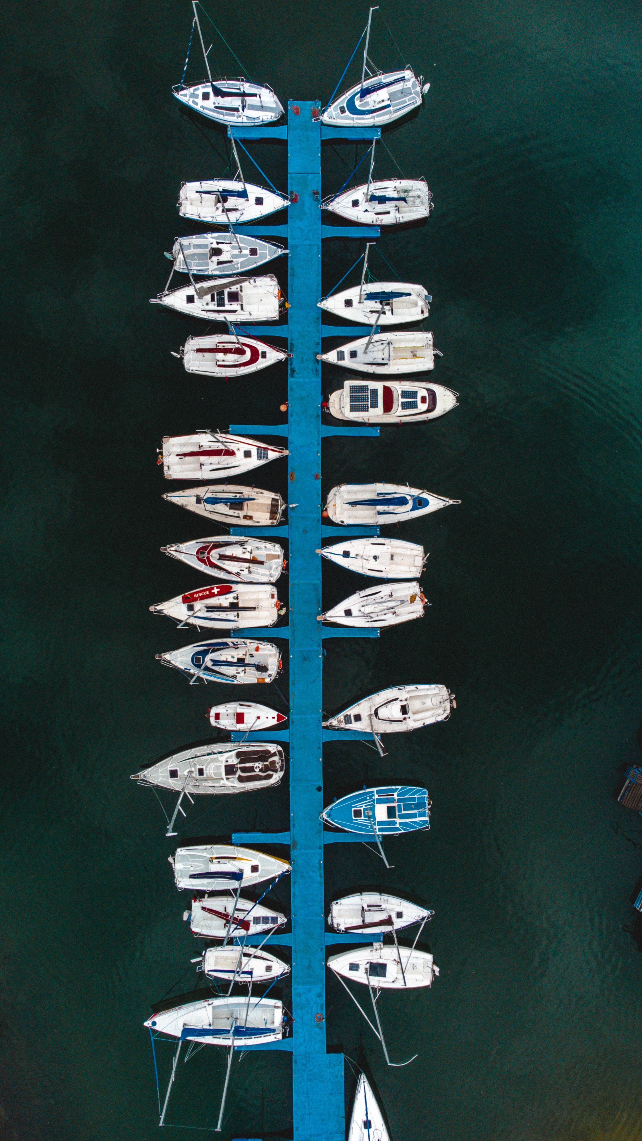 Birds Eye View of Pier with Moored Motorboats · Free Stock Photo