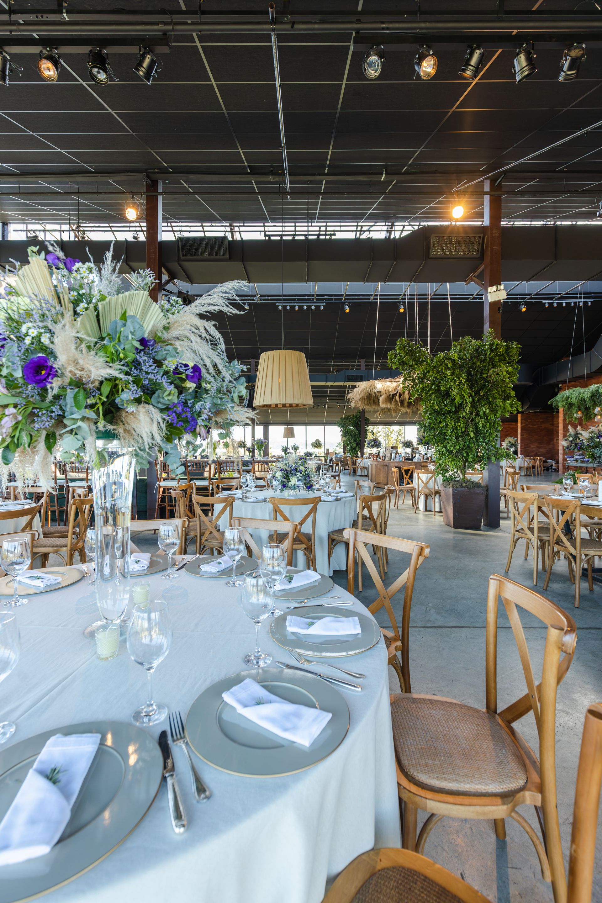 Beautifully arranged wedding venue with floral centerpieces