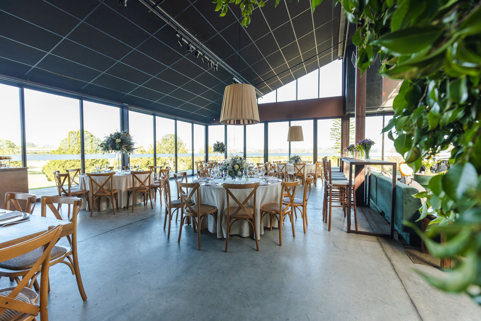 Beautiful wedding reception setup in an elegant venue with panoramic outdoor views.