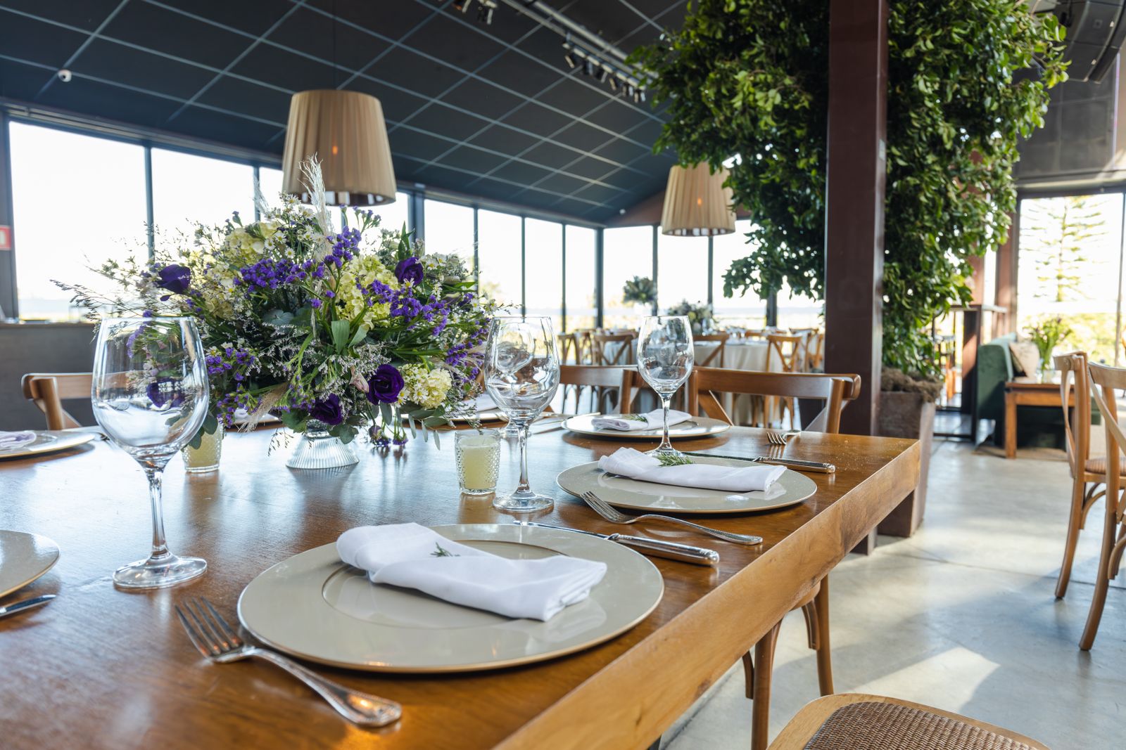 Reception tables laid with floral centrepieces