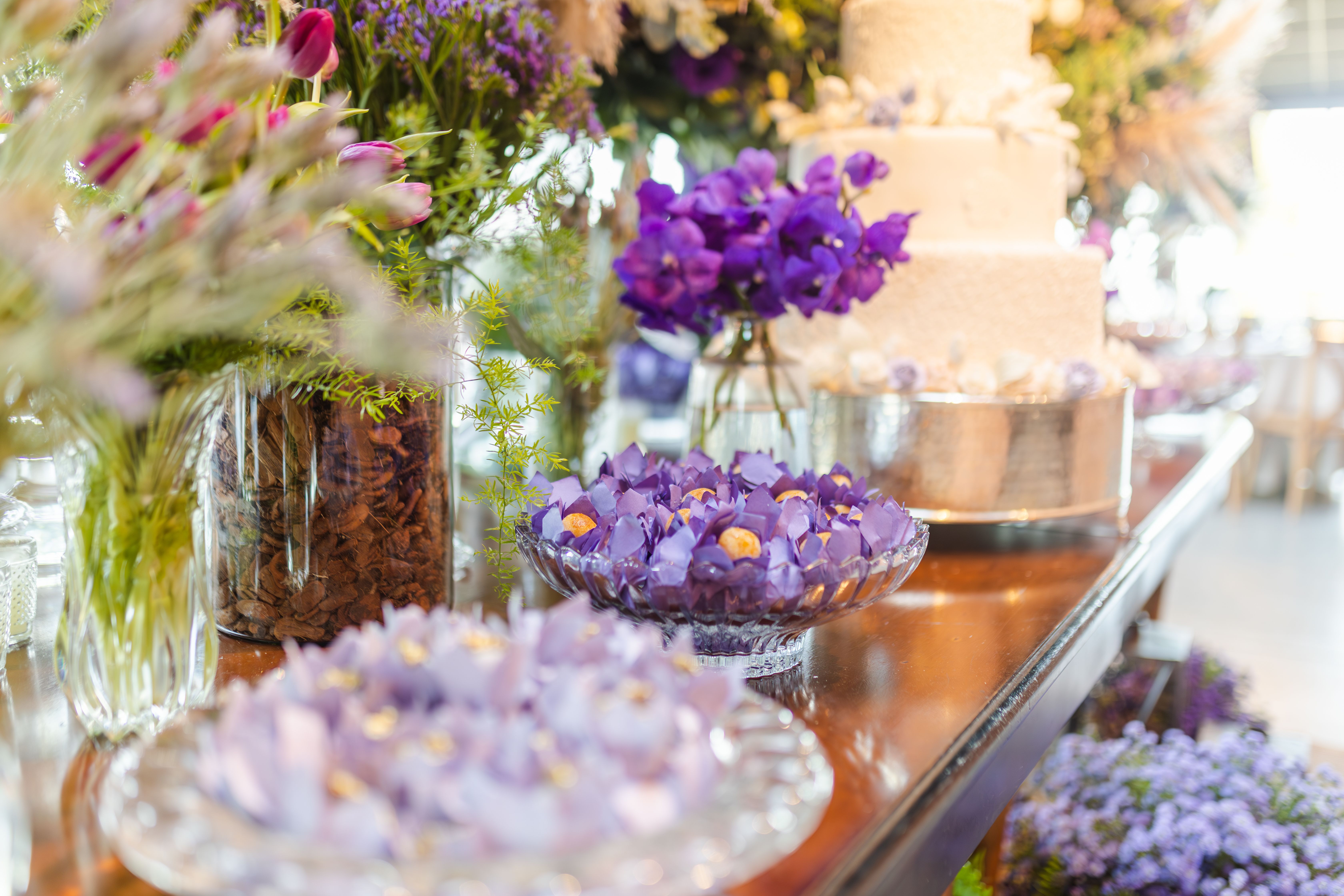 Soft Lavender + Lilac + Pale Gold, wedding table with purple florals and tiered cake illustrating the lavender wedding palette