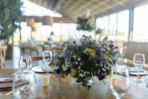 Free A beautifully arranged bouquet on a table set for a special occasion in a bright indoor venue. Stock Photo