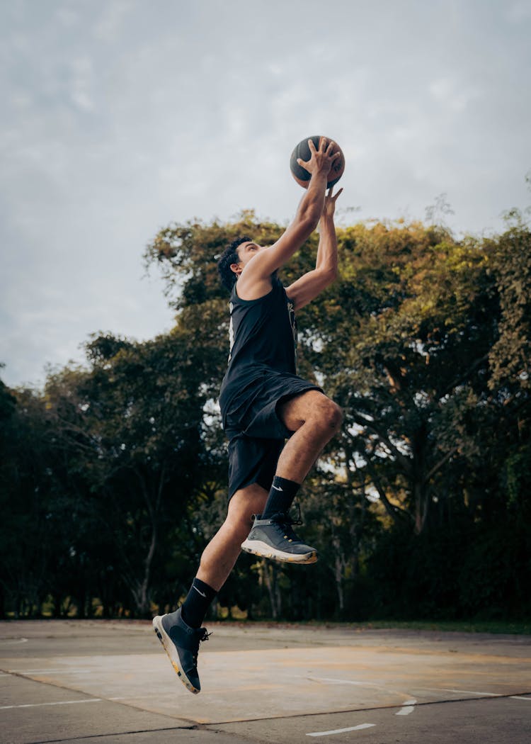 Man Playing Basketball