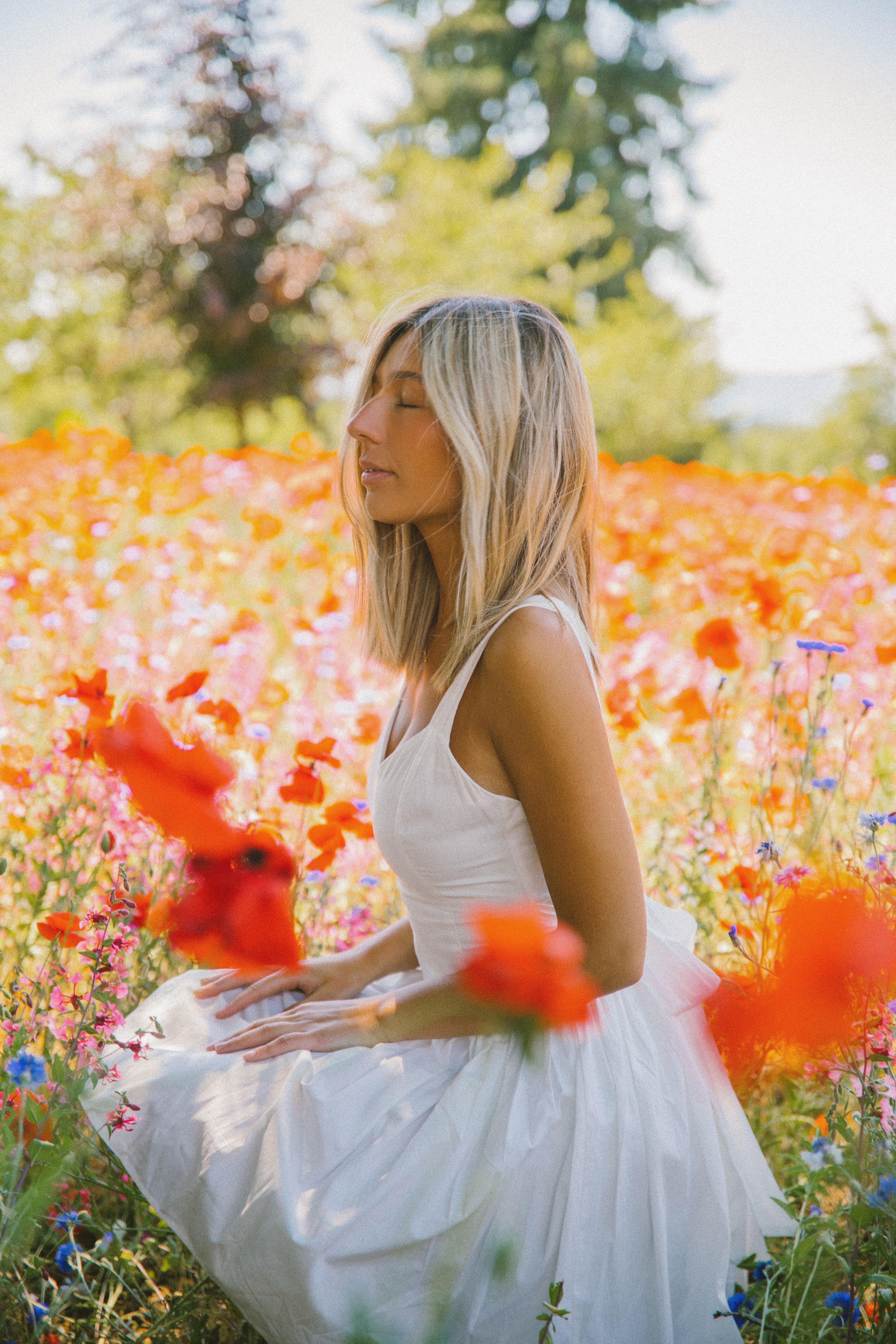 Blonde Woman in White Dress on Meadow with Flowers · Free Stock Photo