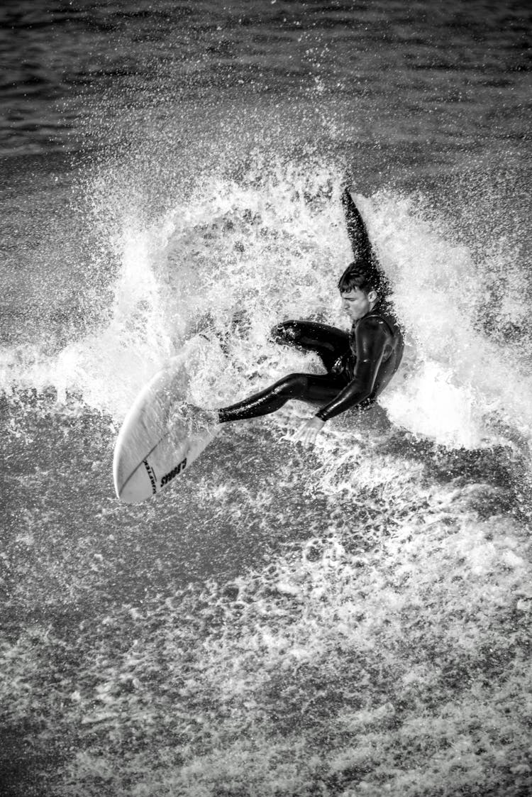 Man Surfing In Sea