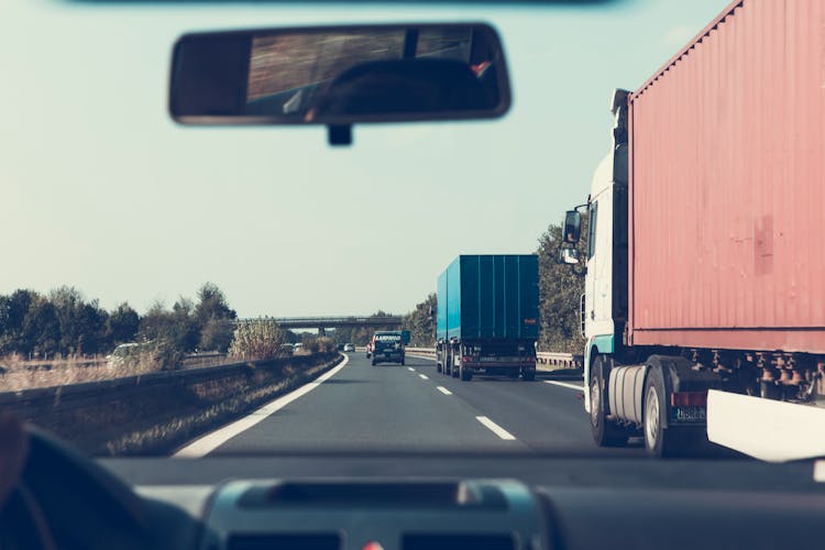 Blue And Red Freight Truck On Road