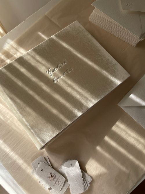 Free Flat lay of a luxurious wedding guestbook and envelopes in soft natural light. Stock Photo
