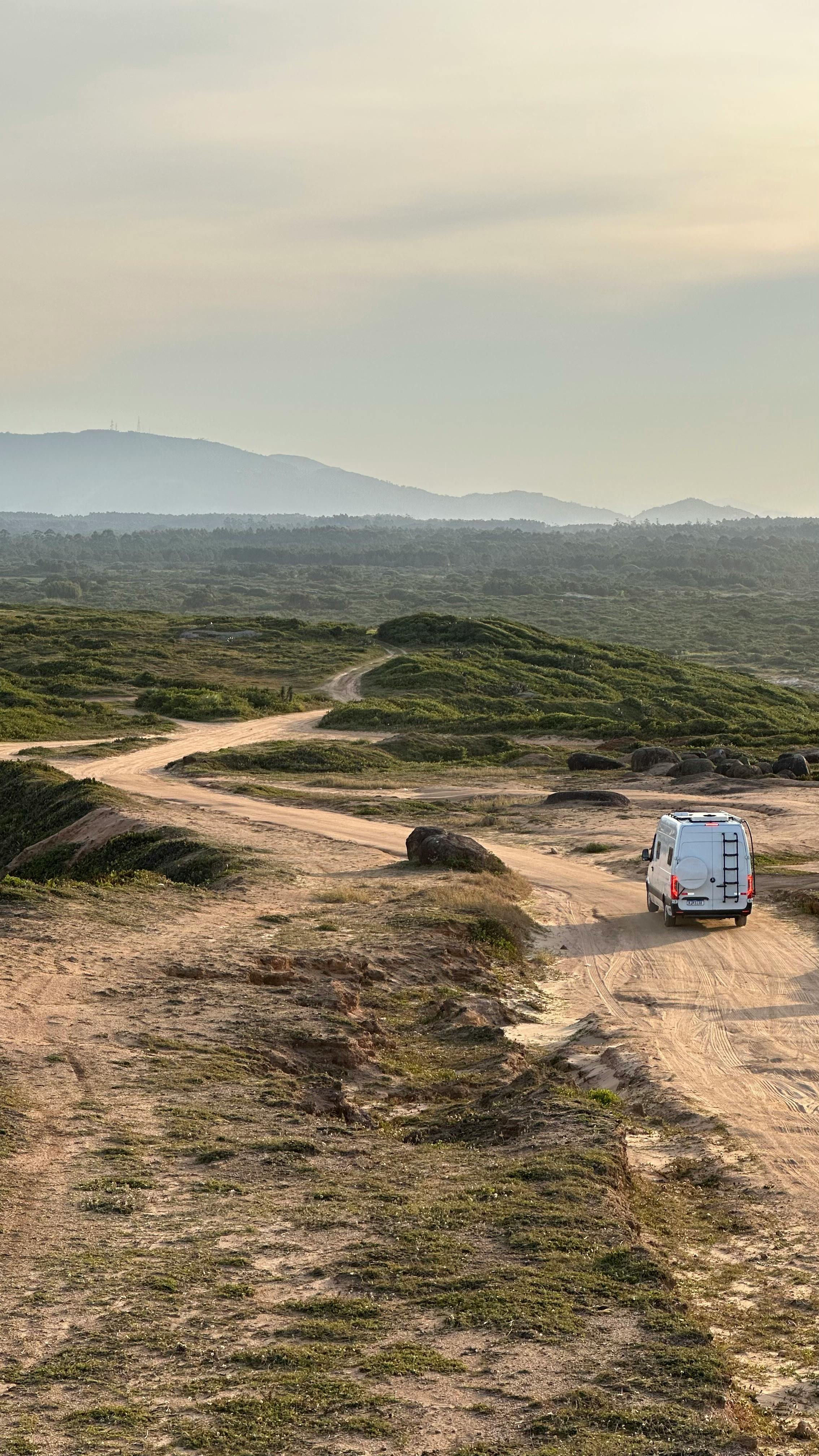 Caravan Running on Dirty Sand Road · Free Stock Photo
