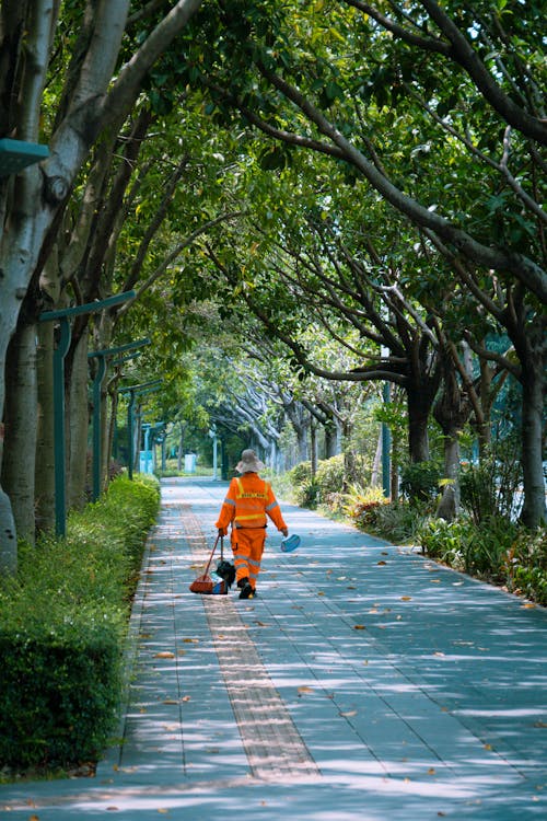 Cleaner Walking at Park