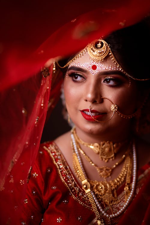 Woman in Red, Traditional Clothing and with Golden Jewelry