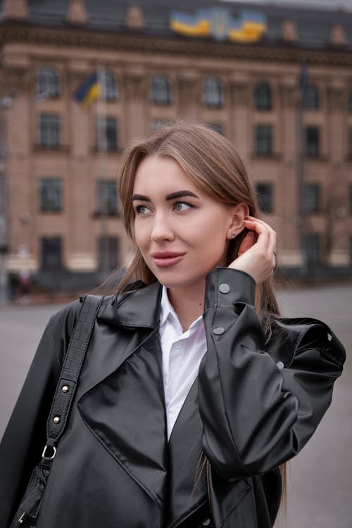 Brunette Woman Wearing Coat on a Street