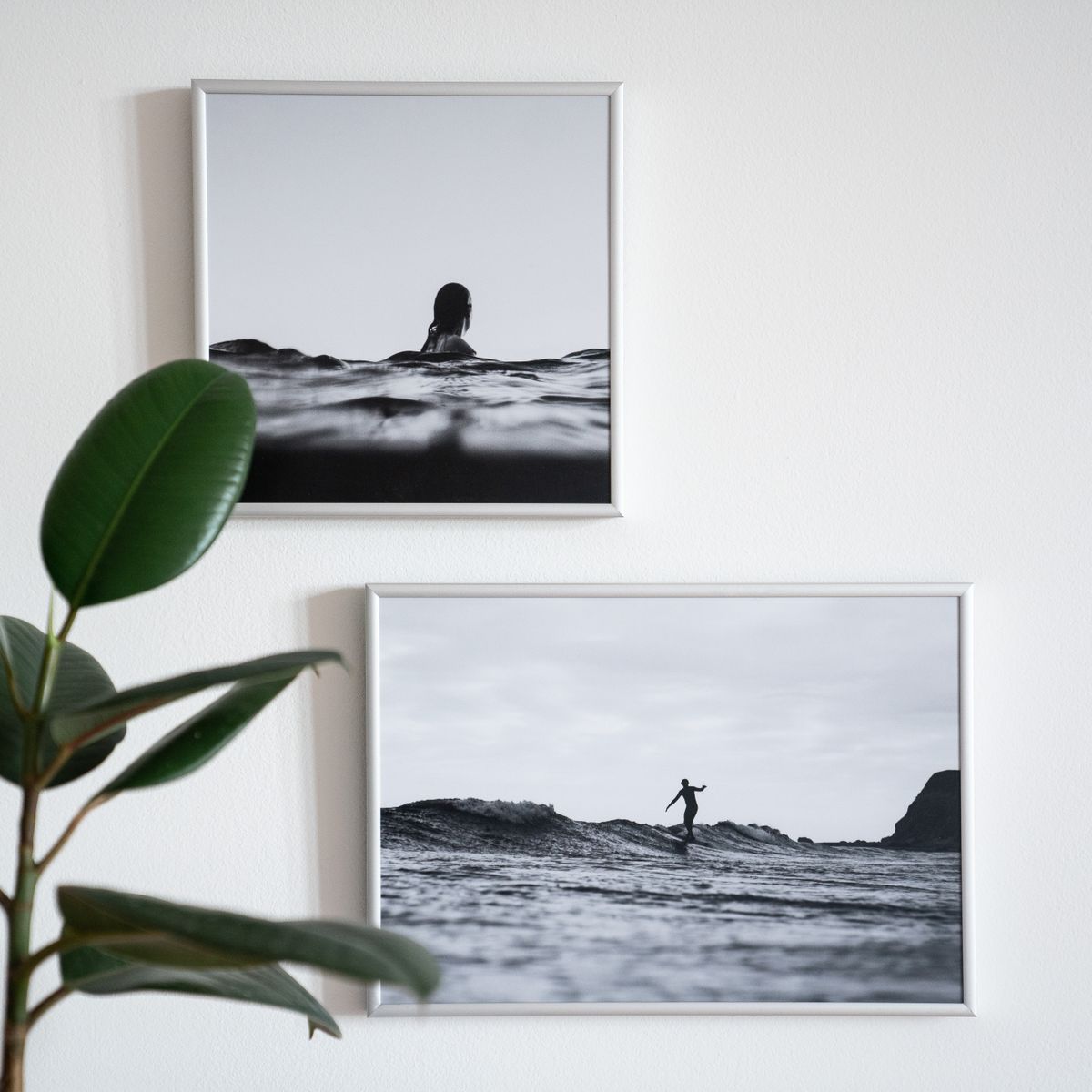 Framed pictures hanging on a wall in a modern interior