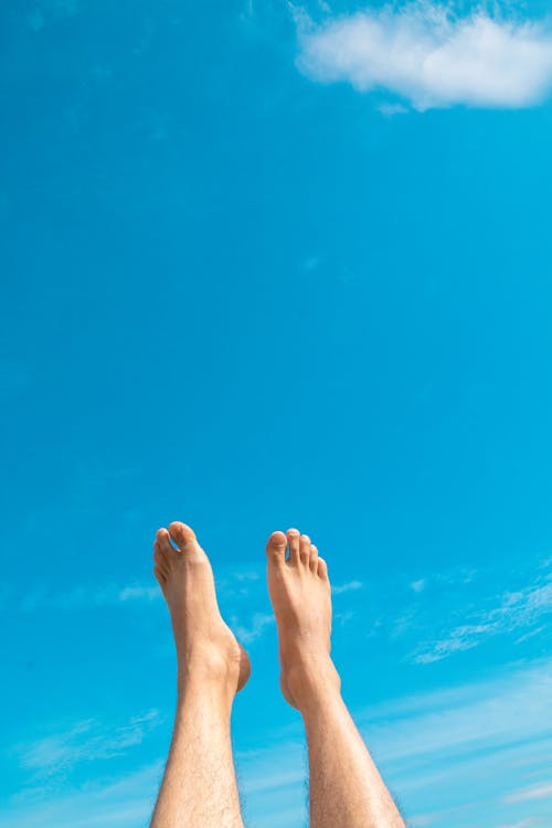 Closeup Photo of Person's Feet in the air