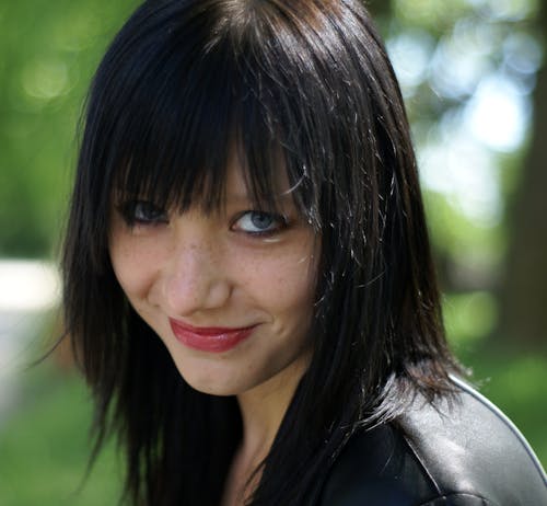 Young Brunette with Bangs and Blue Eyes 