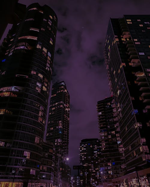 Low Angle Shot of Skyscrapers in City at Night 