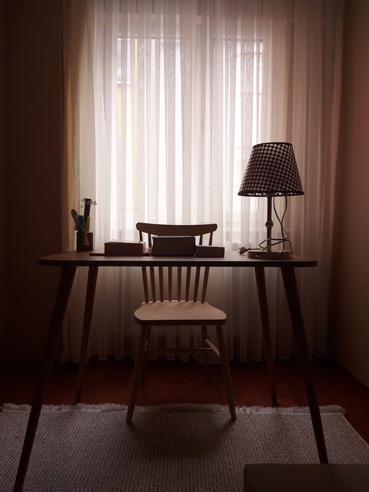 Lamp On Table In Dark Room